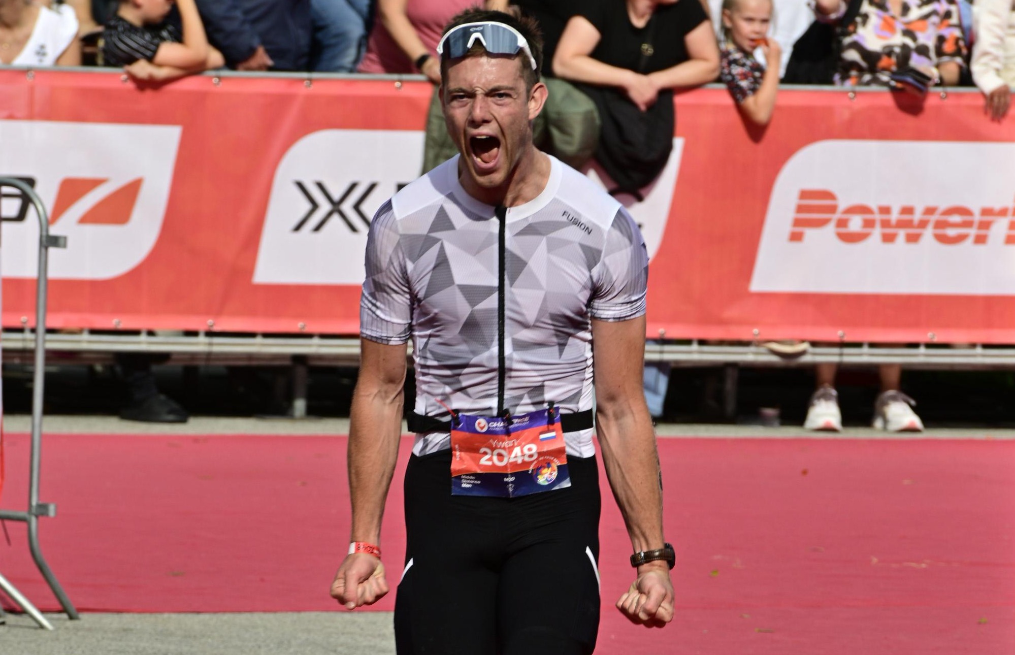 Triathlon finish celebration